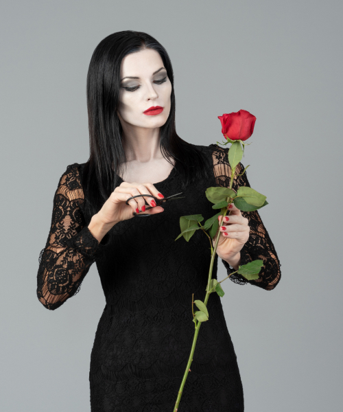 a woman holding an a rose 
