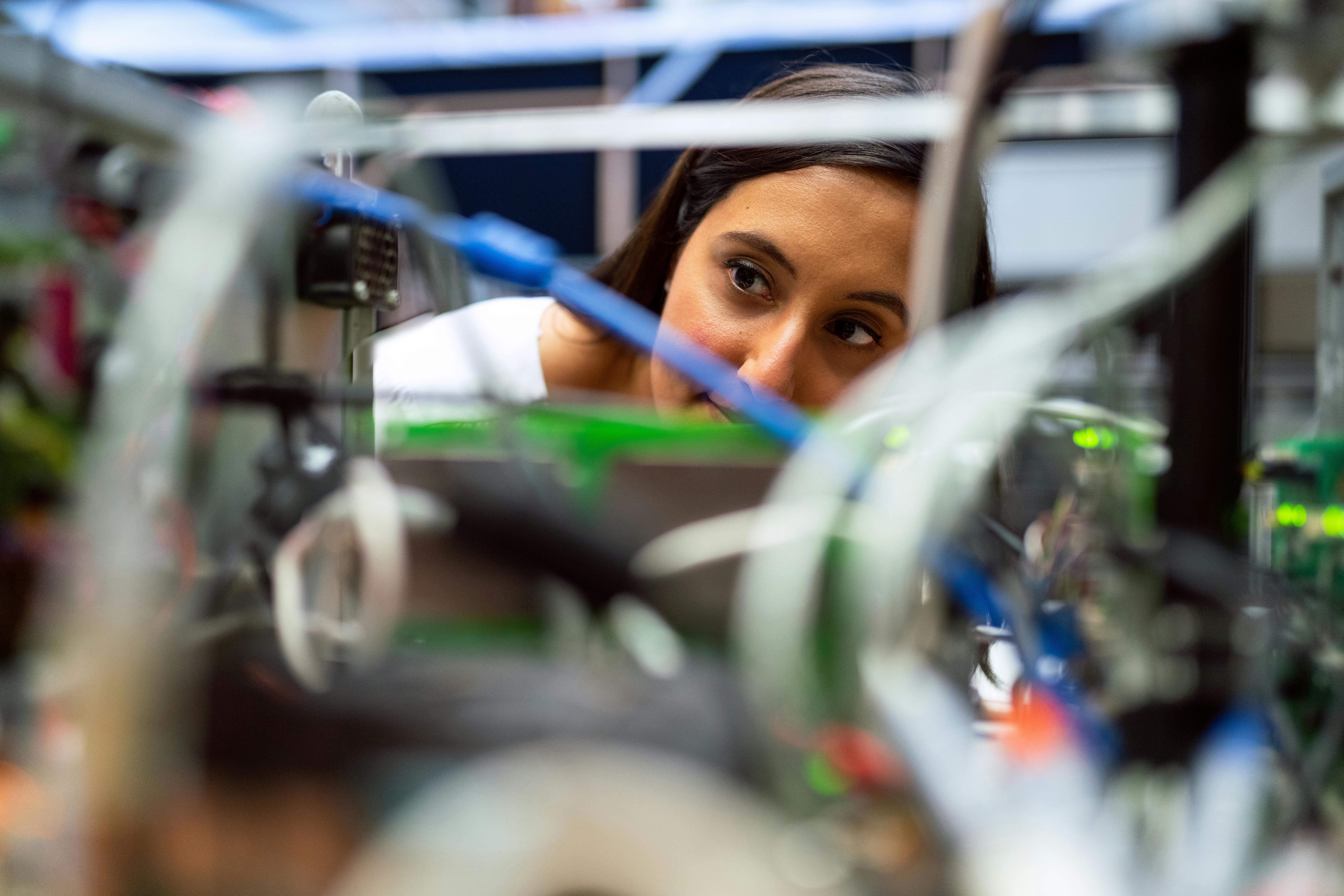 an engineer looking at wires
